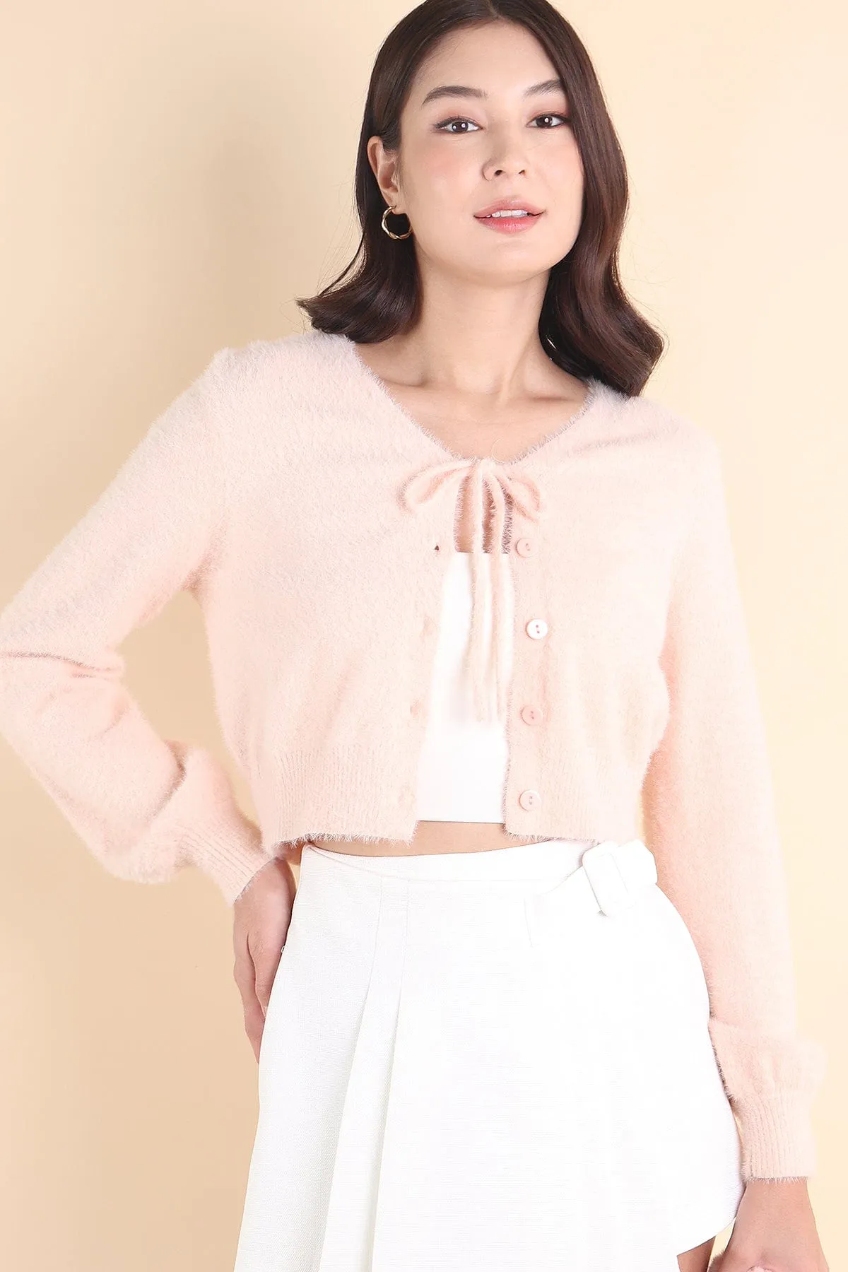 ELIZ BOW FURRY CARDIGAN IN PINK